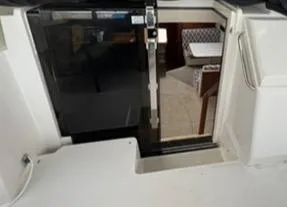 1991 Carver 33 Aft Cabin Motor Yacht interior with open cabin door.