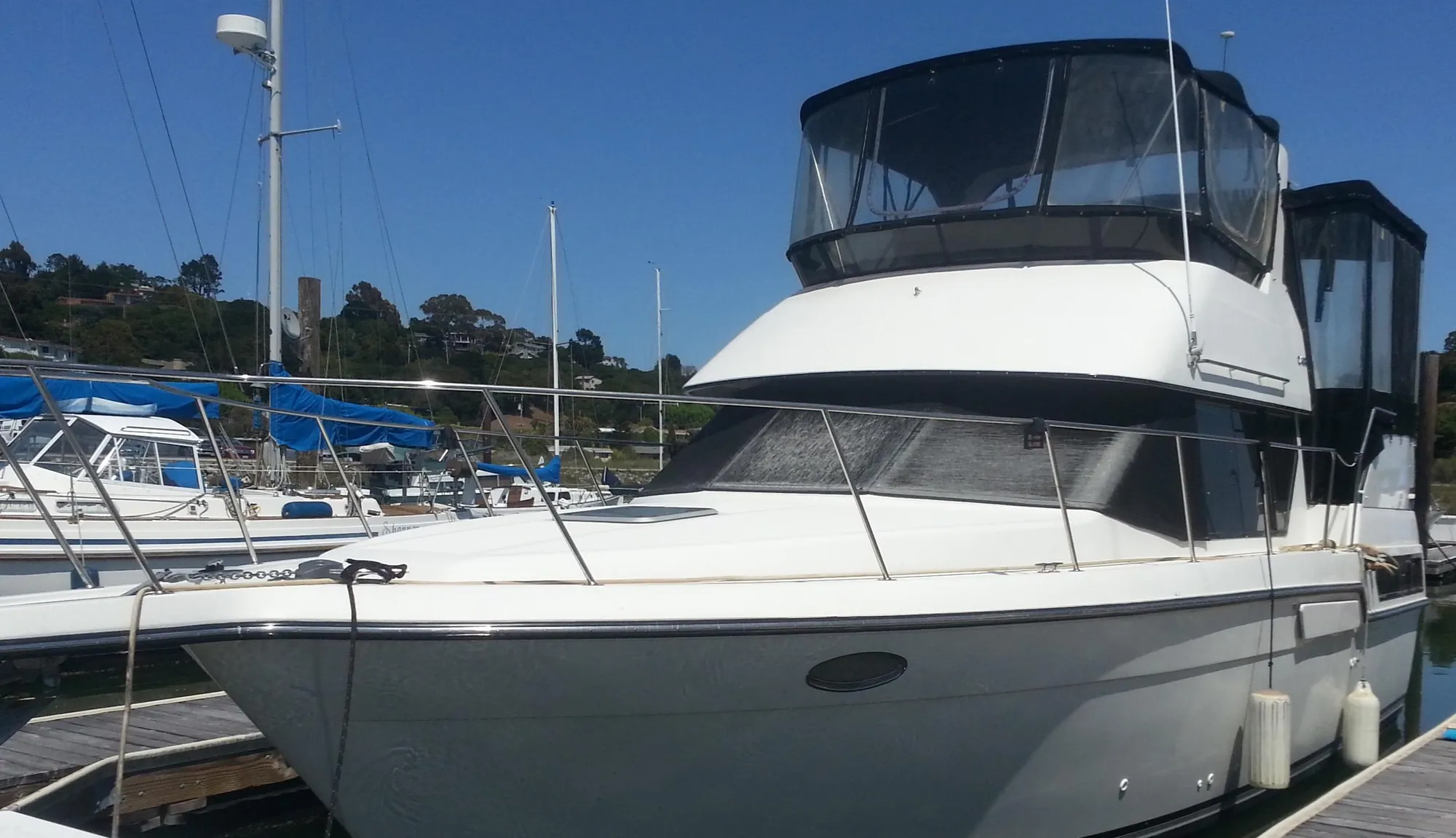 1991 Carver 33 Aft Cabin Motor Yacht docked at marina.