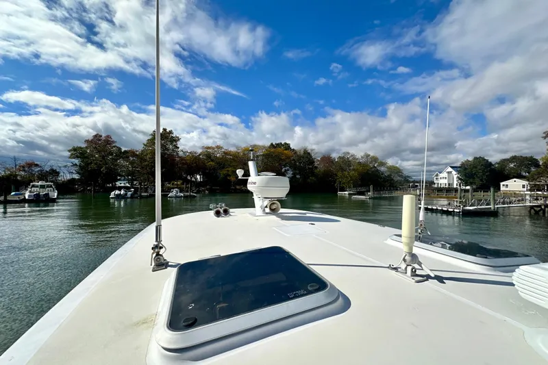 Belle Yacht Photos Pics 2007 Legacy Yachts 34 Sport Express on calm water under a partly cloudy sky.