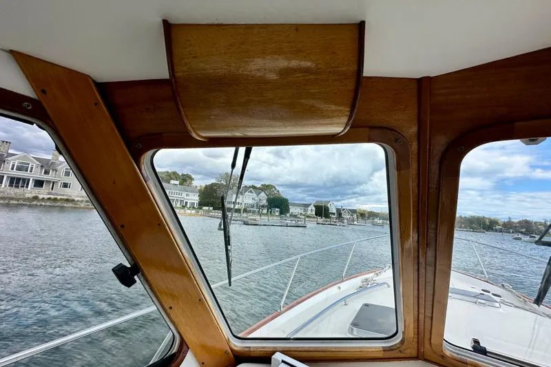 Belle Yacht Photos Pics 2007 Legacy Yachts 34 Sport Express interior view with waterfront houses in the background.