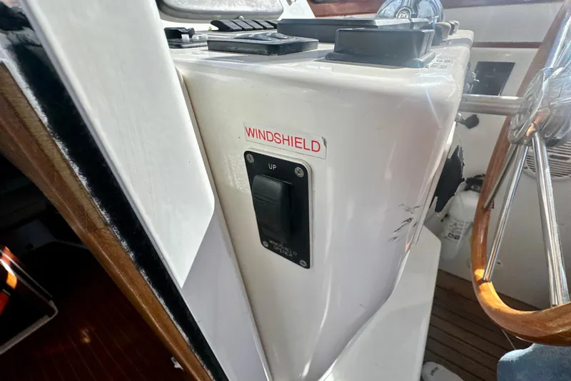 Belle Yacht Photos Pics 2007 Legacy Yachts 34 Sport Express helm with windshield control switch.