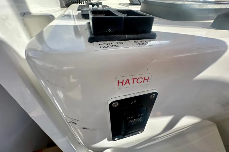 Belle Yacht Photos Pics Control panel on 2007 Legacy Yachts 34 Sport Express, featuring hatch and house switches.