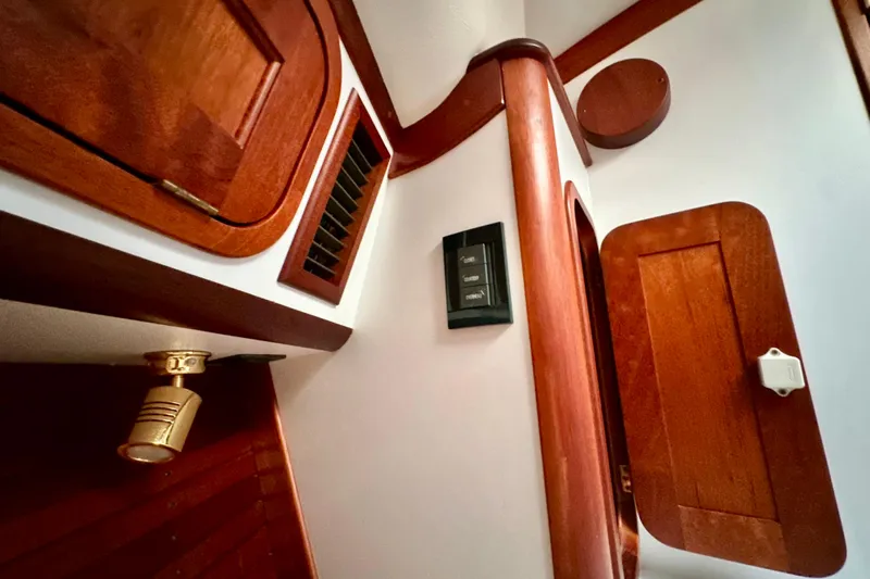 Belle Yacht Photos Pics Interior of 2007 Legacy Yachts 34 Sport Express, featuring elegant wood paneling and fixtures.