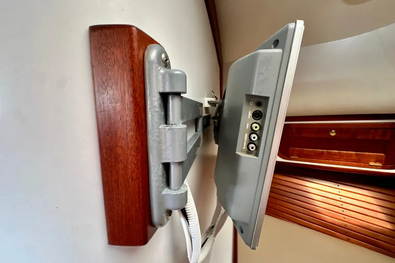 Belle Yacht Photos Pics Wall-mounted TV on 2007 Legacy Yachts 34 Sport Express, showcasing connection ports.