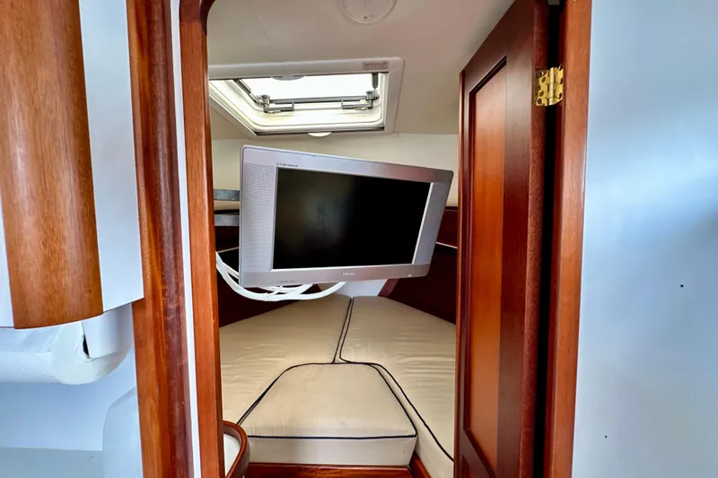 Belle Yacht Photos Pics 2007 Legacy Yachts 34 Sport Express cabin with TV and skylight.