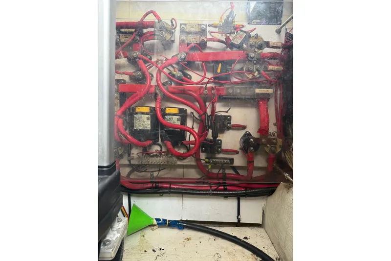 Belle Yacht Photos Pics Electrical wiring system inside 2007 Legacy Yachts 34 Sport Express, featuring red cables and components.