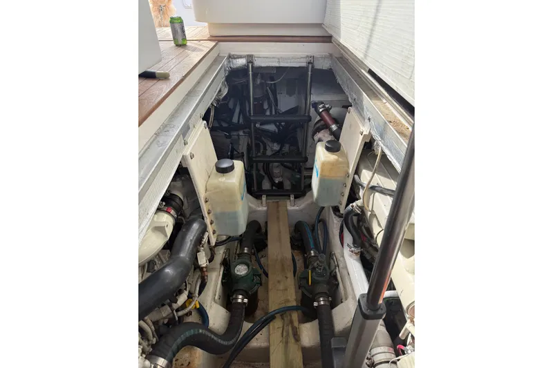 Belle Yacht Photos Pics Engine compartment of 2007 Legacy Yachts 34 Sport Express, showcasing mechanical components and systems.