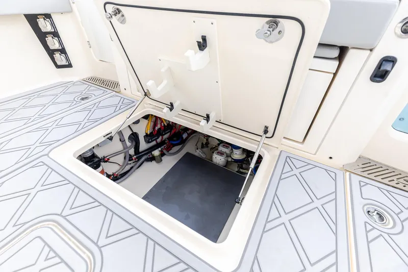 Your Next Boat! Yacht Photos Pics 2024 Scout 377 LXF boat hatch open, revealing internal wiring and components.