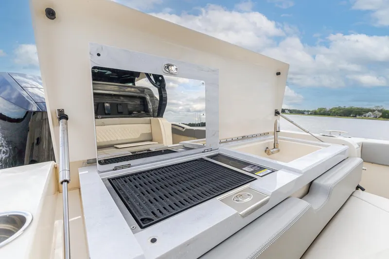 Your Next Boat! Yacht Photos Pics 2024 Scout 377 LXF boat with outdoor grill and sink setup.