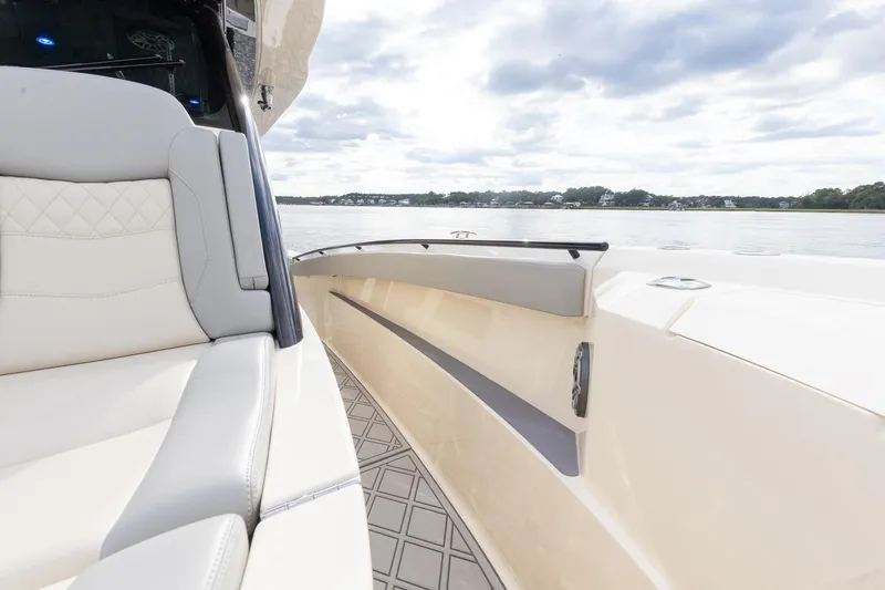 Your Next Boat! Yacht Photos Pics 2024 Scout 377 LXF boat interior with luxurious seating and scenic water view.