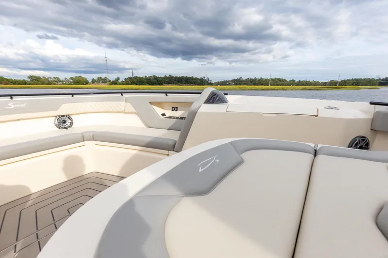 Your Next Boat! Yacht Photos Pics 2024 Scout 377 LXF boat interior with luxurious seating and scenic water view.
