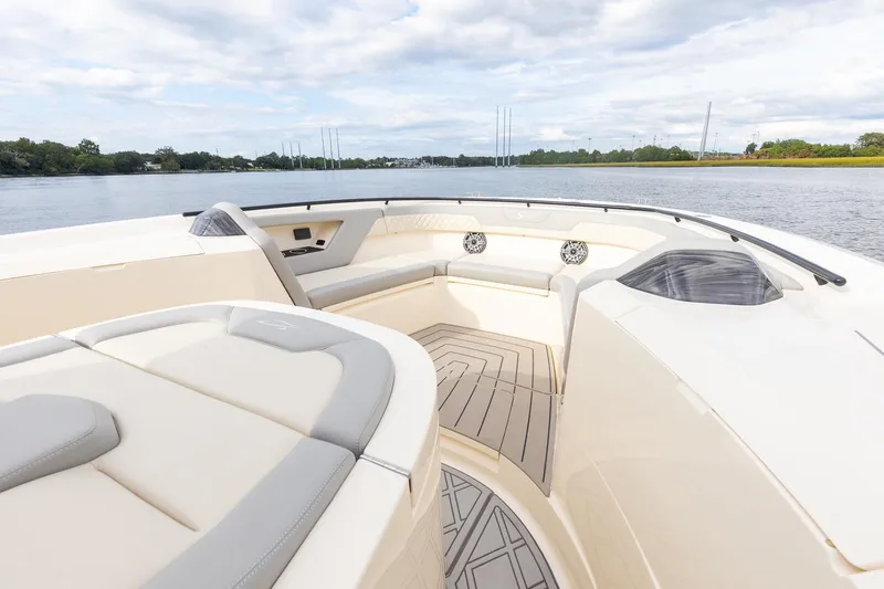 Your Next Boat! Yacht Photos Pics 2024 Scout 377 LXF boat interior with luxurious seating and scenic water view.