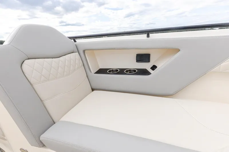 Your Next Boat! Yacht Photos Pics 2024 Scout 377 LXF boat interior with luxurious seating and cup holders.