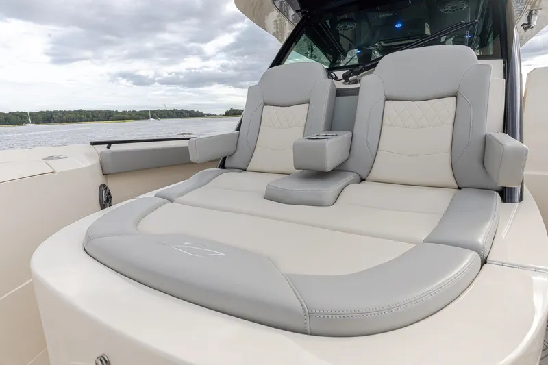 Your Next Boat! Yacht Photos Pics 2024 Scout 377 LXF boat with luxurious seating and elegant design on the water.