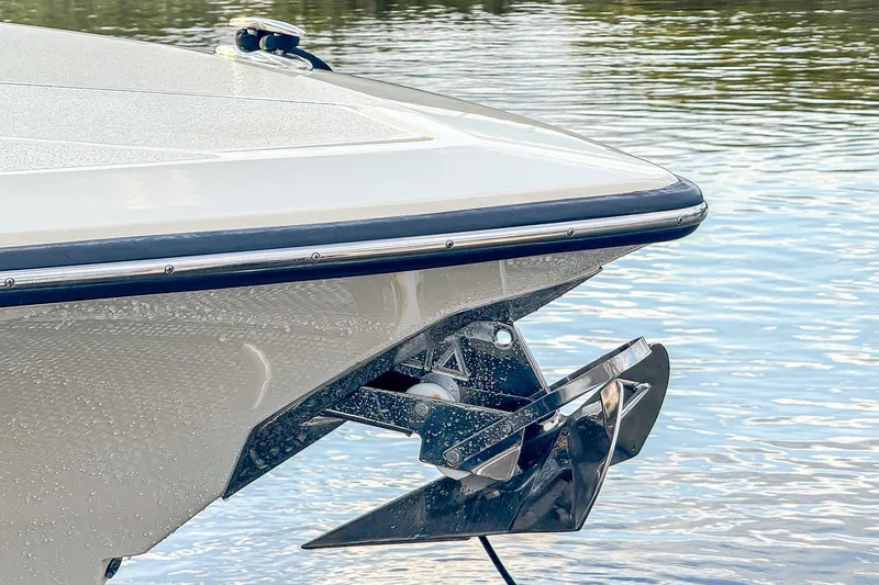 Your Next Boat! Yacht Photos Pics 2024 Scout 377 LXF boat bow with anchor, on calm water.