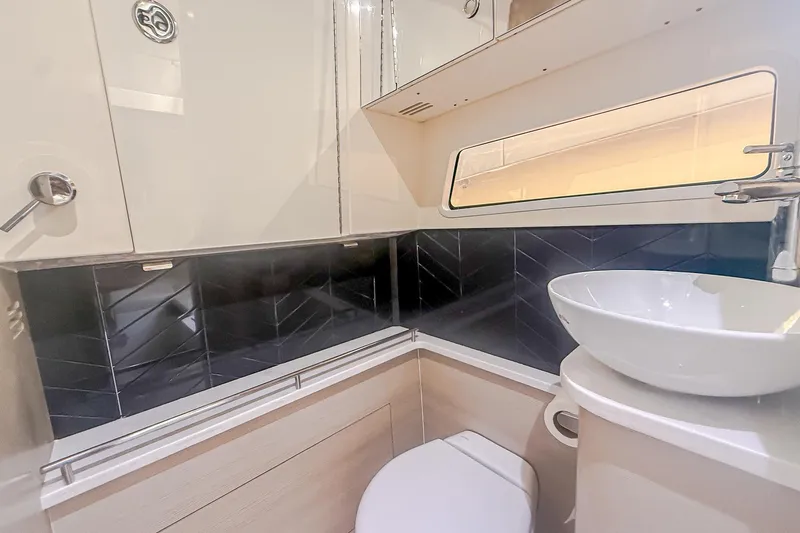 Your Next Boat! Yacht Photos Pics Luxurious bathroom interior of 2024 Scout 377 LXF boat with modern fixtures.