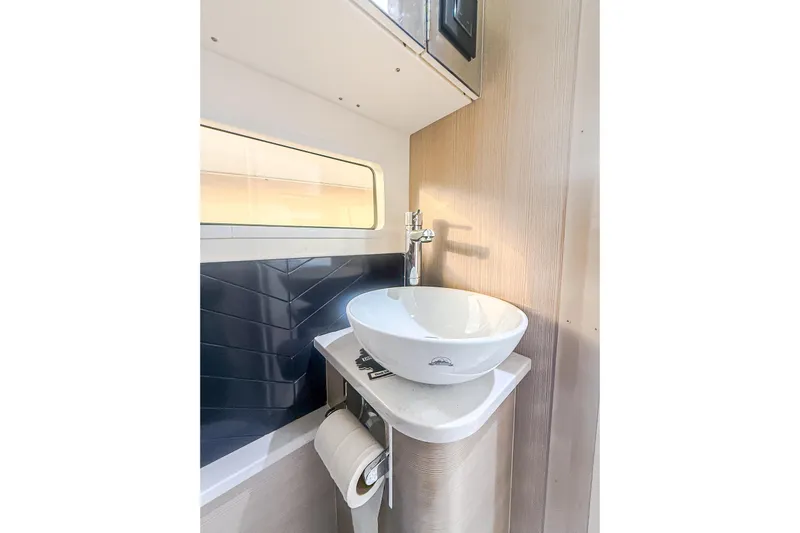 Your Next Boat! Yacht Photos Pics Modern bathroom sink in 2024 Scout 377 LXF boat, featuring sleek design and compact space.