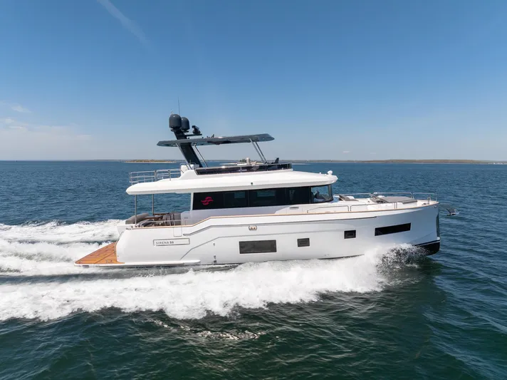 New 2024 Sirena 58 Yacht Photos Pics 2024 Sirena 58 Flybridge yacht cruising on open water under clear skies.