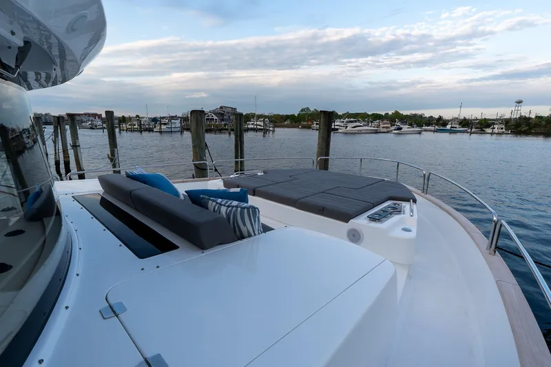 New 2024 Sirena 58 Yacht Photos Pics 2024 Sirena 58 Flybridge yacht with spacious deck and scenic marina view.