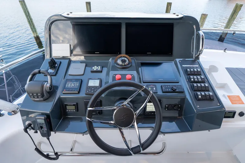 New 2024 Sirena 58 Yacht Photos Pics 2024 Sirena 58 Flybridge helm with dual screens and modern controls.