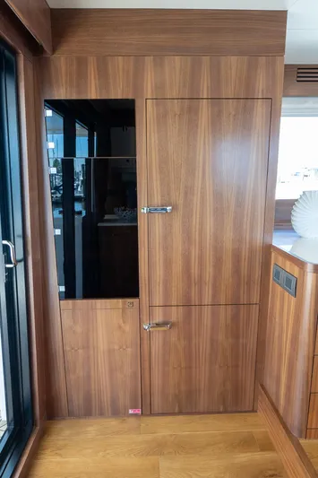 New 2024 Sirena 58 Yacht Photos Pics 2024 Sirena 58 Flybridge yacht interior with sleek wooden cabinetry design.