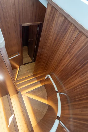 New 2024 Sirena 58 Yacht Photos Pics 2024 Sirena 58 Flybridge yacht interior with elegant wooden staircase design.