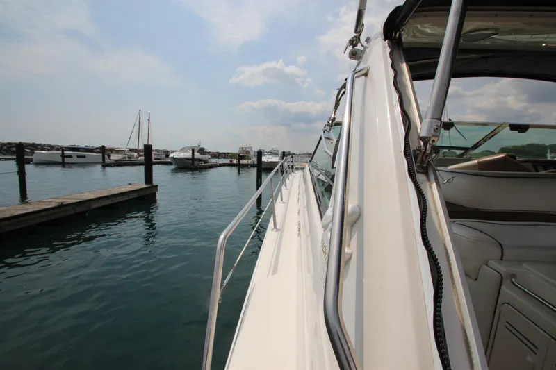  Yacht Photos Pics 1998 Sea Ray 500 Sundancer yacht docked at a marina on a sunny day.