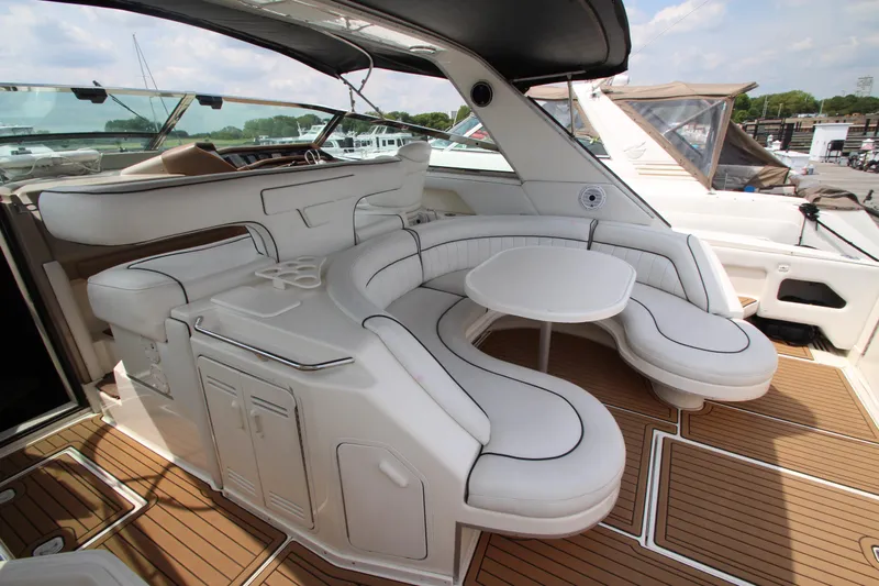  Yacht Photos Pics 1998 Sea Ray 500 Sundancer yacht with spacious white leather seating and wooden deck.