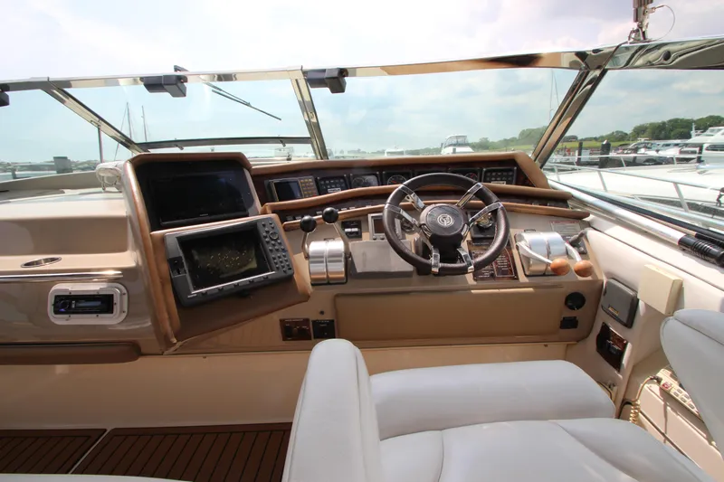  Yacht Photos Pics 1998 Sea Ray 500 Sundancer helm with navigation equipment and leather seating.