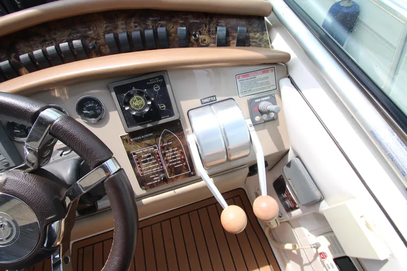  Yacht Photos Pics 1998 Sea Ray 500 Sundancer helm with controls and steering wheel.