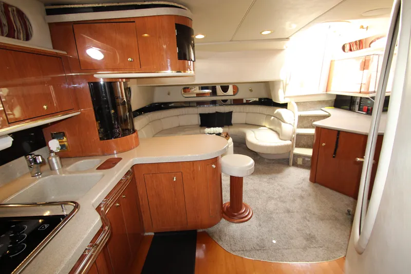  Yacht Photos Pics 1998 Sea Ray 500 Sundancer yacht interior with kitchen and seating area