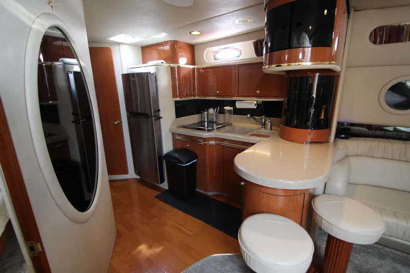  Yacht Photos Pics 1998 Sea Ray 500 Sundancer yacht interior with kitchen and seating area.