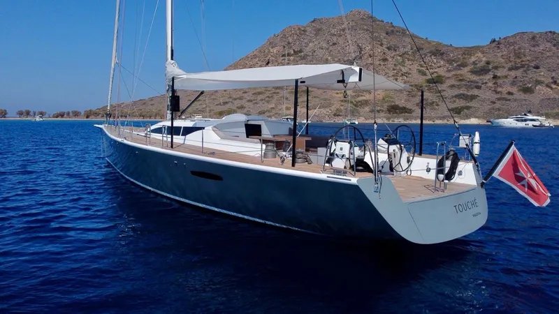 Touché Yacht Photos Pics Sailing yacht "Windseeker Raised Pilot Saloon" 2010 model, anchored in clear blue waters.