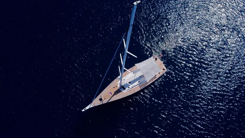 Touché Yacht Photos Pics Aerial view of 2010 Windseeker Raised Pilot Saloon sailing on deep blue water.