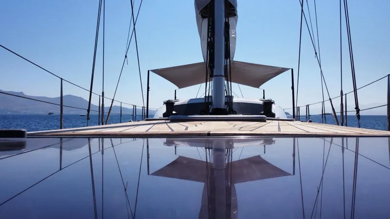 Touché Yacht Photos Pics Sleek Windseeker Raised Pilot Saloon yacht deck, 2010 model, with clear blue sky and sea.