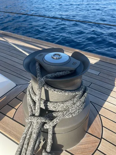 Touché Yacht Photos Pics Winch on Windseeker Raised Pilot Saloon 2010 yacht deck, with ocean in background.