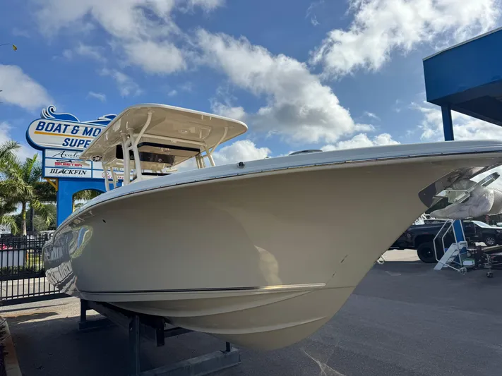  Yacht Photos Pics 2025 Key West 291 FS boat displayed at dealership under blue sky.