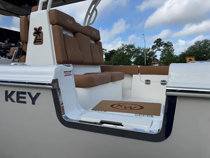  Yacht Photos Pics 2025 Key West 291 FS boat with tan seating and sleek design.