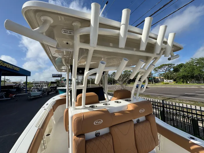  Yacht Photos Pics 2025 Key West 291 FS boat with tan seating and rod holders, parked outdoors.