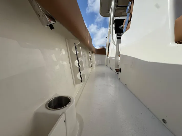  Yacht Photos Pics 2025 Key West 291 FS boat interior with cup holder and rod storage.