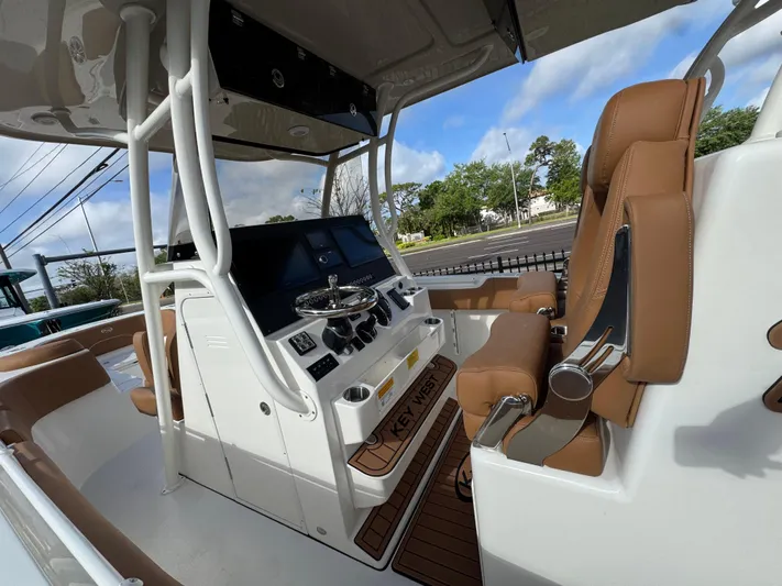 Yacht Photos Pics 2025 Key West 291 FS boat interior with modern helm and tan seating.