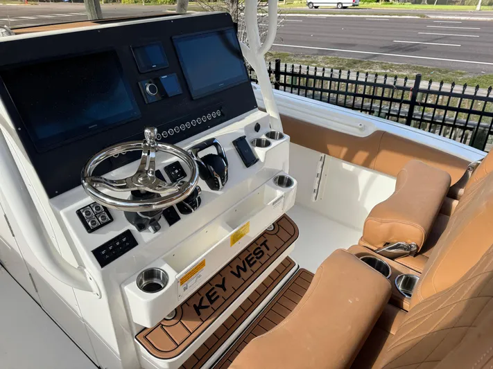  Yacht Photos Pics 2025 Key West 291 FS boat cockpit with modern controls and brown seating.
