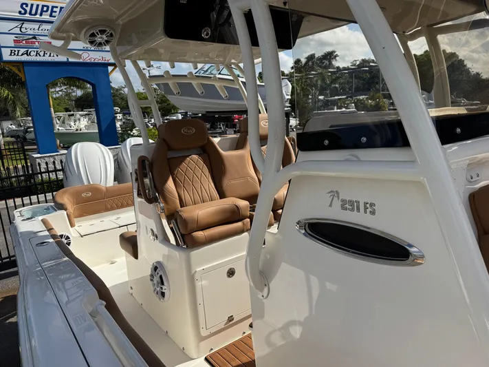  Yacht Photos Pics 2025 Key West 291 FS boat with tan seating and sleek design.