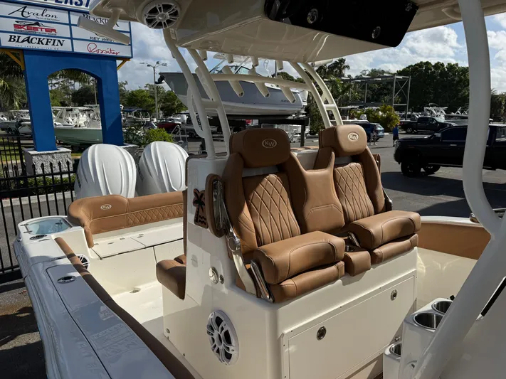  Yacht Photos Pics 2025 Key West 291 FS boat with luxurious tan seating and modern design.