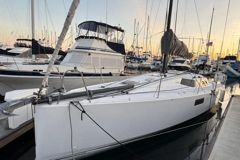 Expresso Yacht Photos Pics Sleek 2019 Pogo 36 sailboat docked at marina during sunset.