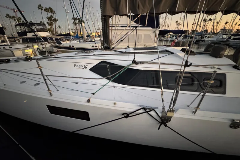 Expresso Yacht Photos Pics Sailboat Pogo 36, 2019 model, docked in a marina at sunset.