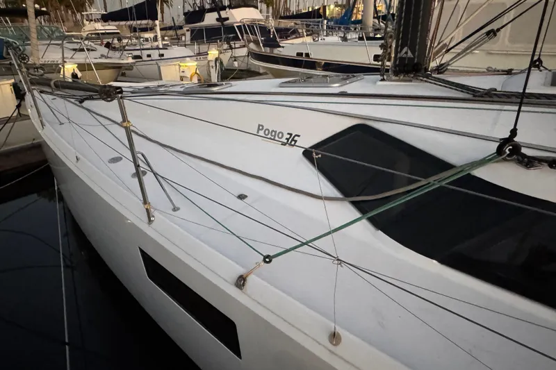 Expresso Yacht Photos Pics Sailboat Pogo 36, 2019 model, docked in a marina with rigging visible.