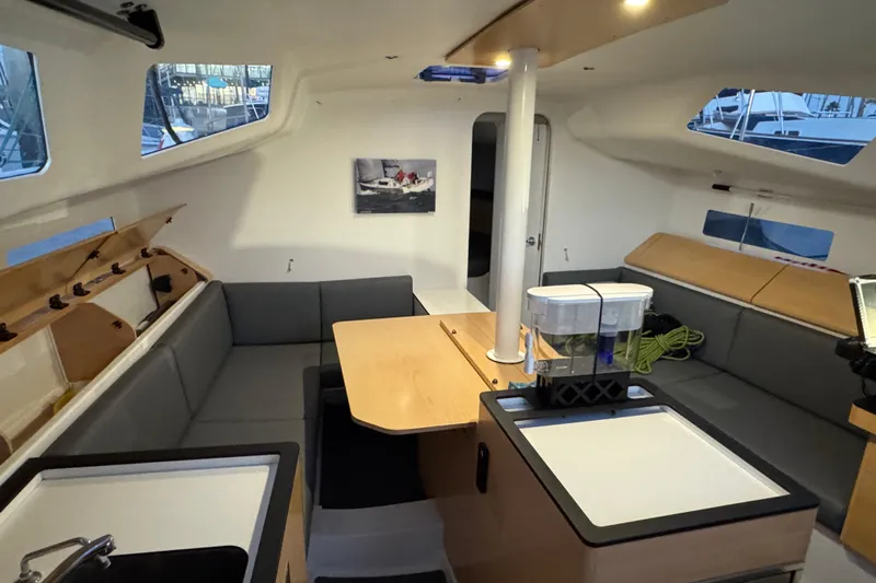 Expresso Yacht Photos Pics Interior of 2019 Pogo 36 sailboat with modern seating and dining area.