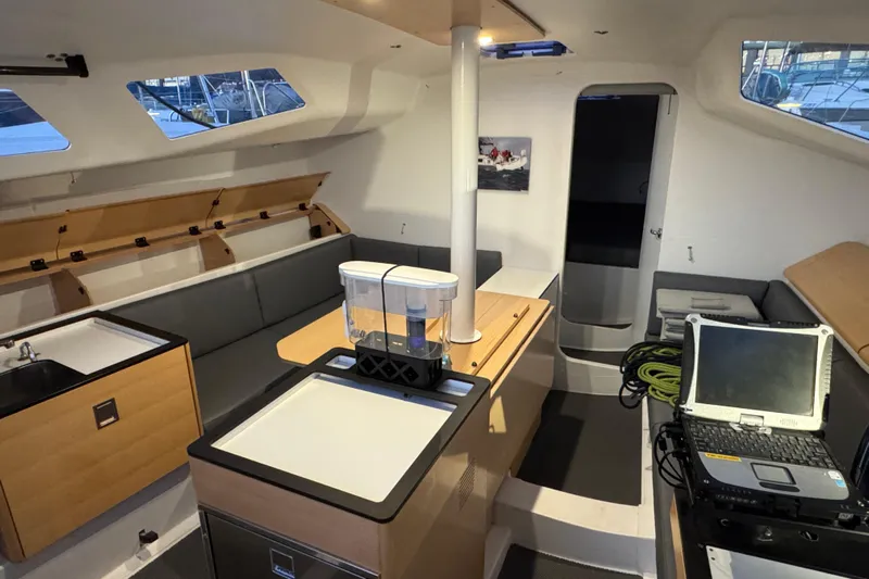 Expresso Yacht Photos Pics Interior of 2019 Pogo 36 sailboat with modern kitchen and seating area.