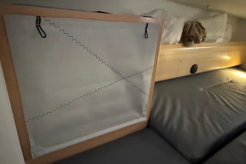 Expresso Yacht Photos Pics Interior of a 2019 Pogo 36 sailboat with bed and storage netting.